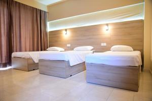Posteľ alebo postele v izbe v ubytovaní Rose Hotel Faliraki