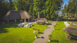 an aerial view of a house with a grass yard at Dom Wypoczynkowy "Pod Strzechą" w Giewartowie in Giewartów +89 photos