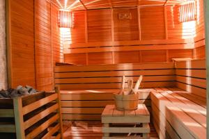 a sauna with a bench and a table in it at Peramis Hotel & Spa in Antalya