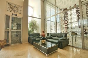 Coin salon dans l'établissement Appart Hôtel Founty Beach
