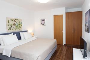 Postel nebo postele na pokoji v ubytování Kanapitsa Mare Hotel