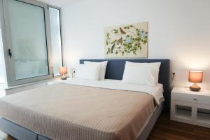 Postel nebo postele na pokoji v ubytování Kanapitsa Mare Hotel