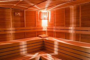 a wooden sauna with a bench in the middle at Peramis Hotel & Spa in Antalya