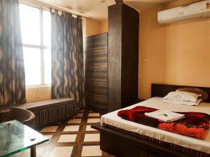 Lova arba lovos apgyvendinimo įstaigoje Hotel Bhagwani Palace