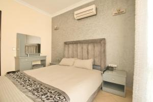 Un ou plusieurs lits dans un hébergement de l'établissement Appart Hôtel Founty Beach