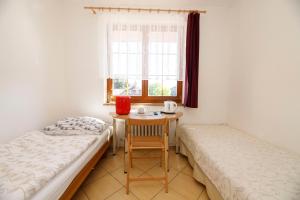 Postel nebo postele na pokoji v ubytování Hotel Vintíř