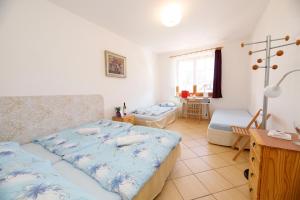 Postel nebo postele na pokoji v ubytování Hotel Vintíř