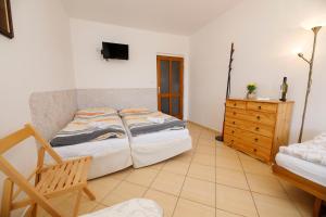 Postel nebo postele na pokoji v ubytování Hotel Vintíř