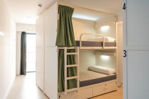 a small room with bunk beds in it at Cal Maco Alberg i centre de visitants in Igualada