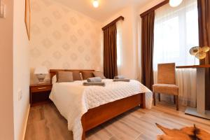 Postel nebo postele na pokoji v ubytování Prenoćište Dvorište