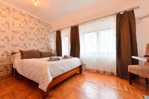 Postel nebo postele na pokoji v ubytování Prenoćište Dvorište