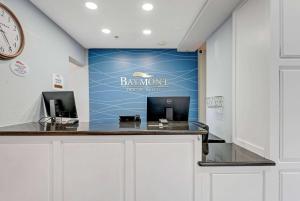 a bar in a dental office with a blue wall at Baymont by Wyndham Salida in Salida