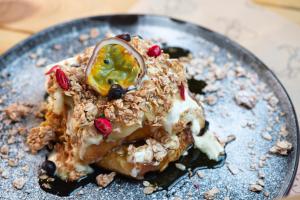 a plate of food with a dessert on it at 31B Urban Stays in Norwich