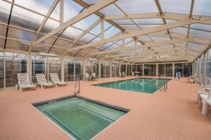 a swimming pool in a building with a roof at Quality Inn Richfield I-70 in Richfield