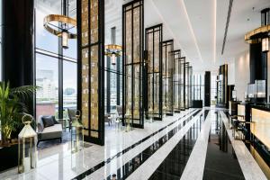 a hotel lobby with a view of the city at Hilton Yokohama in Yokohama +143 photos