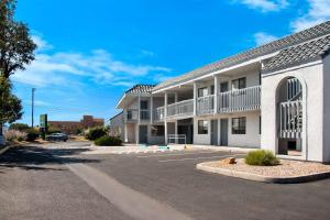 an empty parking lot in front of a building at Quality Inn Santa Fe New Mexico in Santa Fe