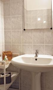 a bathroom with a white sink and a mirror at Cecily's House in Mantova