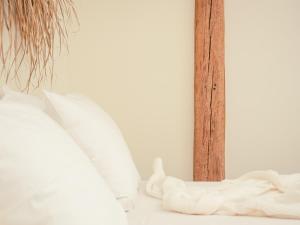 Postel nebo postele na pokoji v ubytování Op Oost Boutique hotel & Restaurant het Kook Atelier