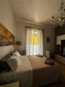 Un pat sau paturi într-o cameră la Mediterraneo Travel