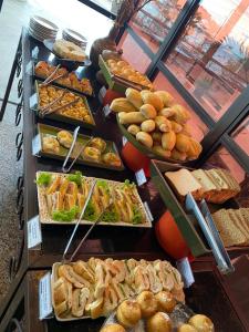 a buffet line with many different types of food at Blue Tree Towers Fortaleza Beira Mar in Fortaleza
