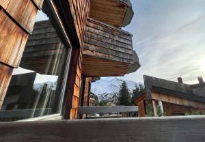 a building with a window with a view of a mountain at Le Little Fox - IMMODREAMS - Avoriaz in Avoriaz