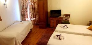 Postel nebo postele na pokoji v ubytování Hotel Rincón Castellano