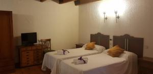 Postel nebo postele na pokoji v ubytování Hotel Rincón Castellano