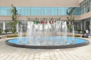 a fountain in front of a building at Phuong Hoang Hotel in Thanh Hóa