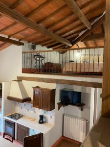 a kitchen with wooden ceilings and a counter top at Agriturismo I Poggi Gialli in Sinalunga