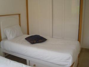 a bedroom with two twin beds with white sheets at Dream Away Luxor in Al Marīs