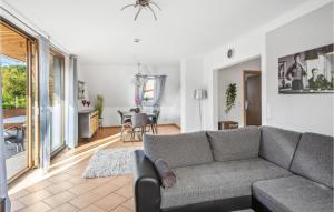 a living room with a couch and a dining room at Stunning Apartment In Wendisch Evern With Wifi in Wendisch Evern