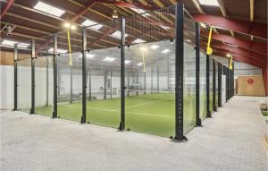 a tennis court inside of a building with a tennis court at Awesome Home In Haslev With Kitchen in Haslev