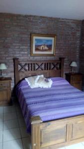 Una cama o camas en una habitación de Cabañas El Molinillo