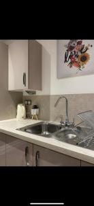 a kitchen with a sink and a counter top at Luxurious suite apartment Scotland in Edinburgh