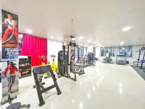 a gym with cardio equipment in a large room at Hotel Panchsheel inn in Ajmer
