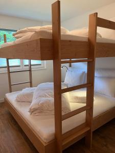 a couple of bunk beds in a room at Sonnenwirbel in Saas-Fee