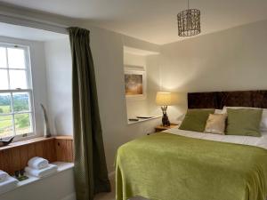 Ένα ή περισσότερα κρεβάτια σε δωμάτιο στο Greenbank Farm House