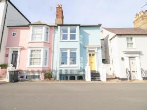 a row of houses on the side of a street at Astondene in Southwold