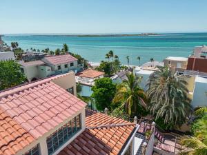 a view of the ocean from the roofs of houses at Casa Palma in La Paz