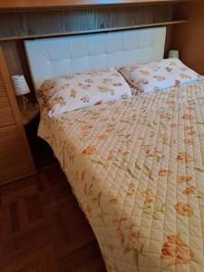 A bed or beds in a room at B&B La Dimora di Alida