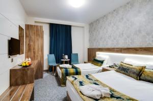 Postel nebo postele na pokoji v ubytování PARK YALÇIN HOTEL