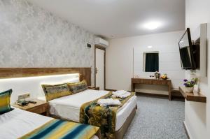 Postel nebo postele na pokoji v ubytování PARK YALÇIN HOTEL