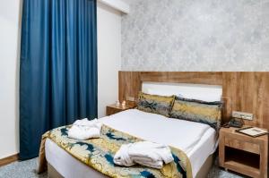 Postel nebo postele na pokoji v ubytování PARK YALÇIN HOTEL