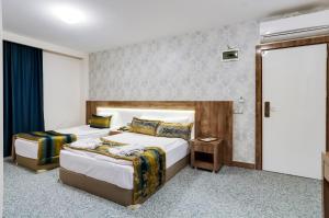 Postel nebo postele na pokoji v ubytování PARK YALÇIN HOTEL