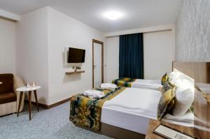 Postel nebo postele na pokoji v ubytování PARK YALÇIN HOTEL