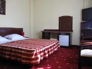 Tempat tidur dalam kamar di Hotel Premiere