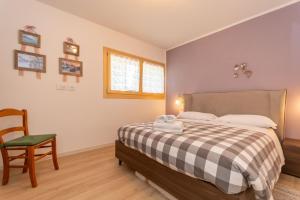 Ένα ή περισσότερα κρεβάτια σε δωμάτιο στο Casa Carducci