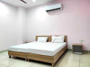 Postel nebo postele na pokoji v ubytování OYO Hotel Palazzo