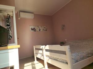 Postel nebo postele na pokoji v ubytování B&B Benvenuto