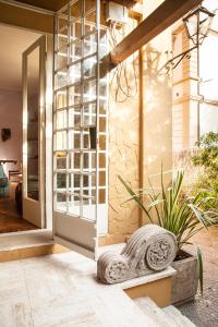 a door to a house with a plant in front of it at Urban jungle in Bologna